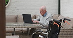 Laptop, research and senior man on a sofa doing research on the internet in a retirement home. Technology, living room and elderly male person from Australia on a website with computer at house.