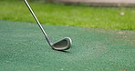 Mini golf, swing and putter on artificial grass with ball in backyard for sports, training and relax with hobby. Game, putting course challenge and club on green lawn with stroke, hit and target.