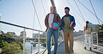 University, happy and men with books at campus for education, knowledge and commute to class together. Bridge, friends and students with discussion for learning, scholarship and travel to academy