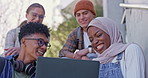 Happy students, diversity and project with laptop for online learning, education or development on stairs at campus. Young people, friends or group on computer for social media, web or assignment