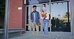 Happy students, friends and laughing with book at campus for education, learning or joke together. Young man, woman or interracial learners enjoying chat, social conversation or bonding at college