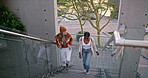 University, college and women on stairs walking for commute to class, lesson and lecture. Academy, school and female students talking, chat and conversation for learning, education and scholarship