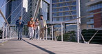 Students, group and walking in city with diversity, talk and ready for learning, education or school. People, bridge and gen z friends with backpack, chat or check watch for class schedule at campus