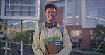 University, face and student with books for education, learning and knowledge development with literature. Happy man, portrait or academic resources at college campus for studying, test or assessment