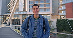 University student, man and smile with face in city, backpack or ready for education, bridge and progress. Person, campus and happy for scholarship, studying and development at college in Mexico