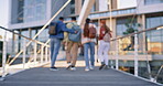 University, friends and people with travel to campus for education, conversation or learning together. Academy, discussion and back of students walking on bridge for scholarship, study or development