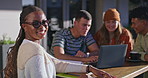 Group of people, together and chat as friends with laptop phone, bonding or social in conversation on campus. Friends, happy and tech for education, scholarship and learning in college or university