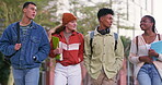 Group of people, diversity and talk as friends with walking together, bonding and conversation on campus. Students, chat and positive for education, scholarship and learning in college or university