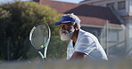 Mature, man and ready with racket for tennis sport on court with game challenge, fitness and competition contest. Male athlete, gear or pitch for sports match, cardio performance and retirement hobby