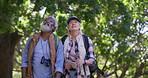 Old couple, hiking and outdoor talking on vacation, fitness adventure and conversation in nature. People, sightseeing and map for direction in countryside, tourist travel and trekking in Mexico woods