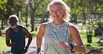 Mature couple, race and fitness in park with smile, competitive and activity for cardio. Happy woman, man and running on path for wellness, motivation and exercise, workout and challenge for health
