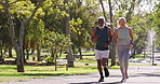 Fitness, running and mature couple in nature for exercise, wellness and competitive. Interracial partners, energy and action in park for challenge, healthy body or support in relationship for cardio