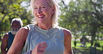 Mature couple, running and fitness in park with smile, competitive and activity for cardio. Happy woman, man and race on path for wellness, motivation and exercise, workout and challenge for health