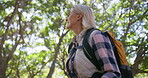 Fitness, hiking and mature woman in nature for thinking, journey and travel in forest. Ecologist, trekking and adventure with backpack for research, exercise and environment study in Canada woods