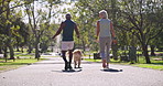 Interracial couple, back and walking with pet dog at park for bonding, animal care or fresh air in nature. Mature man, woman and labrador with leash for stroll together on path at outdoor forest