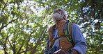 Hiking, low angle and senior man with fitness, forest and nature with adventure, journey and break. Old person, outdoor and pensioner with wellness, healthy and travel with environment or countryside