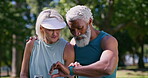 Conversation, fitness and time with interracial old couple in park together for break from training. Exercise, watch or wellness with senior man and woman talking progress in nature for bonding