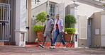 Mature couple, holding hands and outdoor for on holiday for bonding, break and travel as tourist. Relationship, people and smile or happy with walking on summer vacation to relax, enjoy and fun