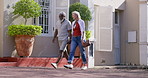 Holding hands, walking and senior couple in city on holiday for tourism, travel or sightseeing. Marriage, outdoor and interracial man and woman in town road for adventure on vacation or weekend trip.
