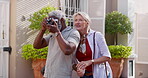 Mature couple, outside and camera for photography with bonding or fun, break and summer holiday. People, multiracial relationship and happy or smile as tourist on road vacation, love and memories