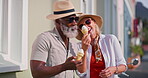Mature couple, laughing and outdoor with ice cream for bonding or fun, break and summer holiday. People, interracial relationship and happy or smile on vacation to relax, chill and enjoy as lovers 