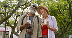 Elderly couple, walking and nature with coffee for connection, joy or memory as partner. Senior people, love and outdoor for bonding, interracial relationship and together for health, wellness or fun