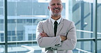 Arms crossed, smile and thinking with business man at window of corporate office for planning. Future, idea and vision with portrait of happy employee in suit at workplace for career development