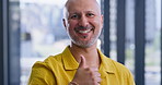Happy, businessman or vote with thumbs up for positive feedback or review at modern office. Portrait, male person or employee designer with smile, like emoji or yes sign for OK, good job or well done