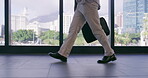 Office building, window and businessman walking with legs for corporate, career and job in morning. Attorney, feet and travel with bag in law firm lobby for professional, work and start of legal case