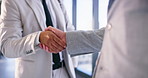 Business people, men and handshake in office with introduction for welcome, greeting or b2b meeting. Company merger, employees or shaking hands in building for partnership deal, agreement or contract