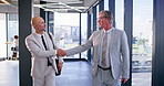Handshake, office space or walking with businessman and realtor greeting in workplace for sale. Meeting, property or welcome with client and real estate agent shaking hands for deal or thank you