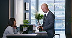 Business man, appointment and reception at corporate consultation agency with secretary. Client, lobby and waiting room with phone at office admin counter and welcome desk with check in for meeting