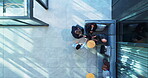 Documents, handshake and travel with corporate people in lobby of office for greeting or meeting. Collaboration, luggage or suitcase with business employee team shaking hands at work from above