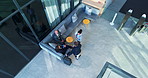 Above, airport and business people with networking, cooperation and conversation with project. Employees, global trade and travellers with ideas, teamwork and cooperation with communication and talk