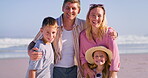 Family, face and beach hug for love, support and trust on trip to tropical island for bonding. Parents, kids and outdoor for embrace in relationship, portrait and travel on ocean holiday for peace