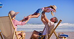 Parents, kids and lifting at beach with smile for fun, break and holiday for bonding in Mauritius. People, family and happy or excited at ocean for summer vacation, adventure and relax with fun