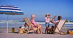 Family, playful and children on beach outdoor with high five games, tropical island and bonding together. Parents, kids and relaxing with fun for vacation travel, ocean activity and love of picnic