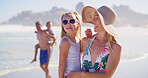 Walking, woman and family in vacation, outdoor and children with parent, happy and travel for bonding. Beach, people and kids in holiday, carrying and mom with youth, relax and adventure in weekend