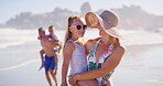 Walking, woman and family in vacation, beach and children with parent, happy and travel for bonding. Outdoor, people and kids in holiday, carrying and mom with youth, relax and adventure in weekend