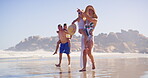 Playing, children and parents in vacation, beach and bonding of family, happy and travel for adventure. Outdoor, people and kids in holiday, mom and dad with youth, relax and paradise in weekend