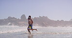 Playing, dad and son in beach, fun and holiday for bonding, travel and adventure in nature and water. Outdoor, tropical and fresh air for child with father, ocean and happy in paradise, kid and trip