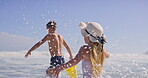 Siblings, children and happy at beach with running for fun, bonding and support in Bali. People, kids and smile or excited with playing ocean on summer holiday, adventure and break to relax and love