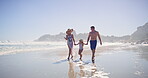 Walking, family and child with holding hands on beach, travel vacation and bonding by seaside. Blue sky, mother and father with girl for holiday adventure, connection and kid jump with joy on ocean