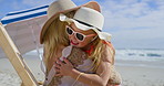 Sea, hug and family with smile, beach chair and embrace of mother and child outdoor in sun. Happy, vacation and travel with love, support and care together by ocean on summer holiday in Miami