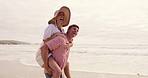 Funny, piggyback and walking with couple on beach together for honeymoon holiday, travel or vacation. Anniversary, love or romance with happy man and woman outdoor in nature for adventure or bonding