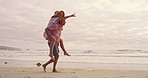Piggyback, pointing and walking with couple on beach together for honeymoon holiday, travel or vacation. Carry, romance or show with happy man and woman outdoor in nature for adventure or bonding
