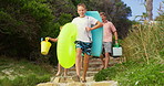 Energy, holding hands and steps with family at beach together for holiday, travel or vacation. Excitement, running or smile with mother, father and children outdoor on stairs for bonding in summer