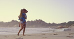 Beach, carrying or walk with mother and daughter on sand outdoor for holiday, travel or vacation together. Love, morning or relax with single parent woman and girl child by ocean or sea for bonding