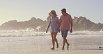Happy, couple and beach with holding hands, calm and walking with love, holiday and outdoor date. Support, vacation and people together with ocean, sea and summer travel in Bali for anniversary