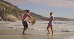 Blown away, hat and water with couple on beach on vacation in summer with waves. Outdoor, nature and lost and found item with help, support and love together with relax people by sea in Miami